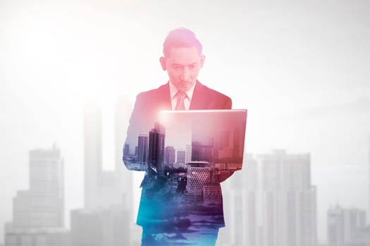 Business man with multiple exposure holding tablet computer. Business technology concept