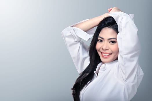 Beautiful face of young adult woman with clean fresh skin over blur background