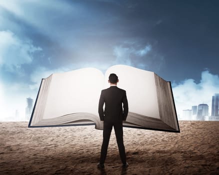 Young business man reading big book. Business education concept