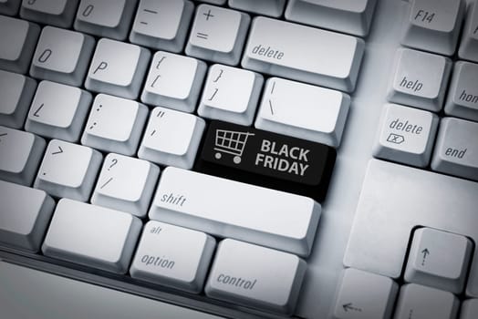 Black friday text and shopping cart on keyboard. Black friday concept