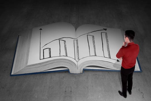 Business person looking book with rising chart page. Business knowledge concept
