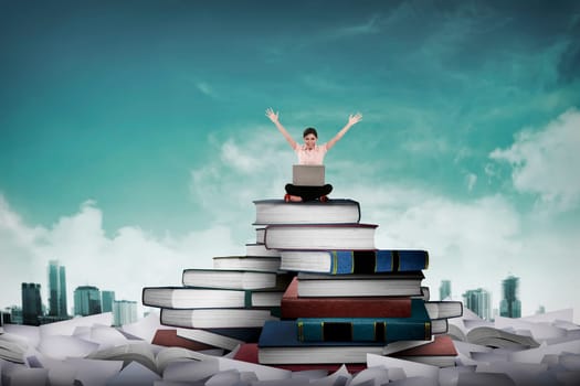 Asian business person working with laptop sit on top of book. Idea and knowledge concept