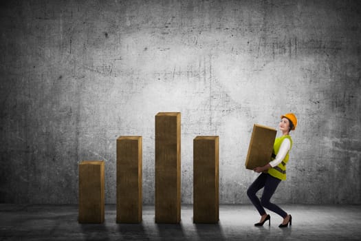 Asian business woman lifting block of chart. Business challenge concept