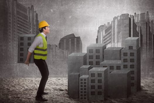 Asian business man building city. Business development concept
