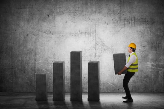 Asian business man carry heavy chart bar. Business development concept