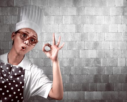Portrait of young woman chef over abstract background