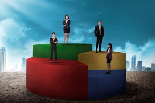 Asian Business Team Standing On Pie Chart
