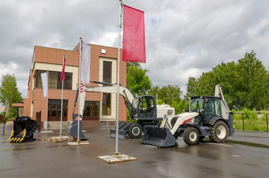 New road-construction equipment outdoors on the exhibition