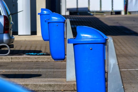 Trash cans,garbage cans on a highway parking lot with service area..