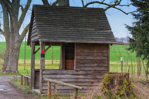 Old wooden hut to protect against wind,rain or snow at a pond near the town of Heiligenhaus in Germany.