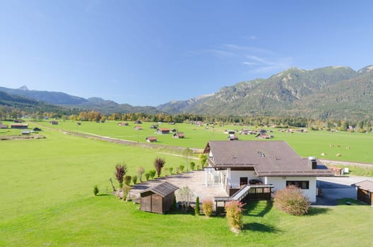 View of Alpine highland pasture in valley at foothills of Bavarian Alps