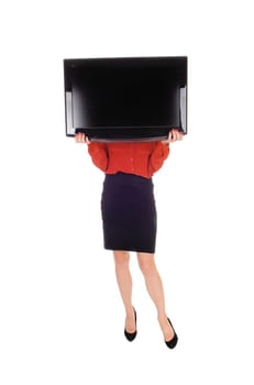 A young woman standing isolated for white background holding a.flat TV in front of her face, standing in a black skirt and red blouse..