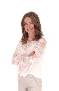 A beautiful young woman in a lace blouse and brunette hair standing.smiling isolated for white background..