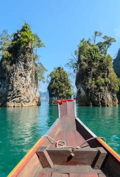 Beautiful limestone mountain ranges and natural attractions with long-tailed boat at Khao Sok National Park in Surat Thani Province, Thailand
