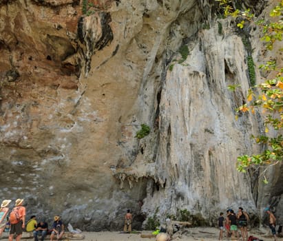 Beautiful limestone mountain cliff and rock climbing activity at Railay beach in Krabi Province, Thailand