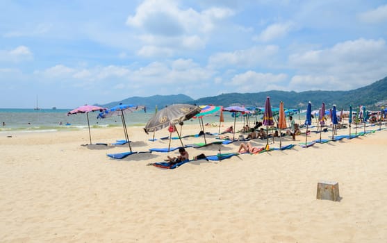 PHUKET, THAILAND - APRIL 11, 2016 : Patong beach, powder-fine white sand beach with crystal clear water in Phuket province, Thailand.
