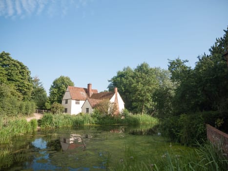 Willy Lotts' cottage and river front on a clear sunny day  Suffolk  UK