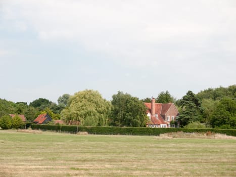 A Farm House in the Distance Across a Field  Essex  UK