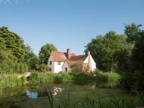 Willy Lotts' cottage and river front on a clear sunny day  Suffolk  UK