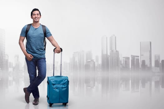 Young asian tourist man with suitcases standing over futuristic background