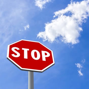 Stop sign against blue cloudy sky