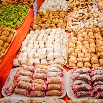 Background of typical sicilian cookies,pastries, made with almond paste for sale in italian market.