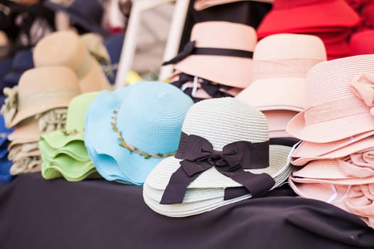 Women's summer hats and scarves at the street market