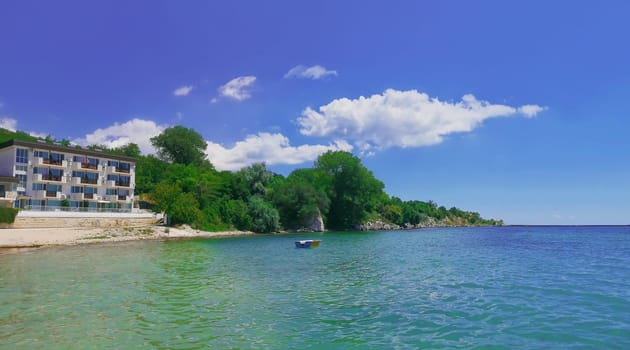 Summer vacation background with a hotel on the seashore. Panoramic view of the coast of Black Sea, Balchik city, Bulgaria