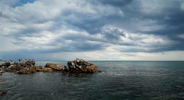 Beautiful seascape with a cloudy sky. Panoramic view at the coast of the Black Sea in Balchik city, Bulgaria.