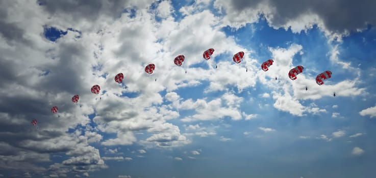 Man paragliding in the sky captured in different phases. Extreme sport.