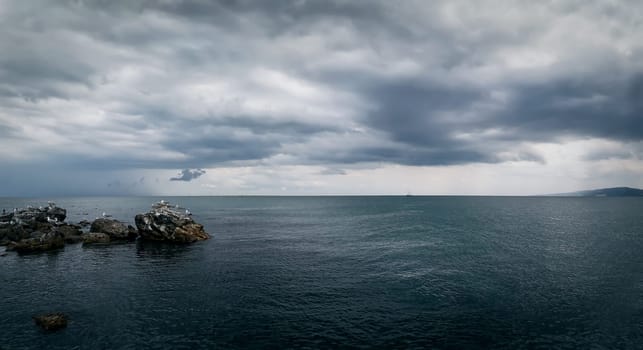 Seascape with a dramatic stormy sky. Beautiful view at the coast of the Black Sea in Balchik city, Bulgaria.