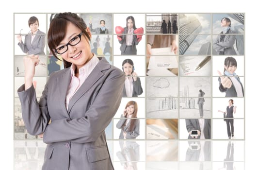 Cheerful Asian business woman standing in front of TV screen wall, closeup portrait.