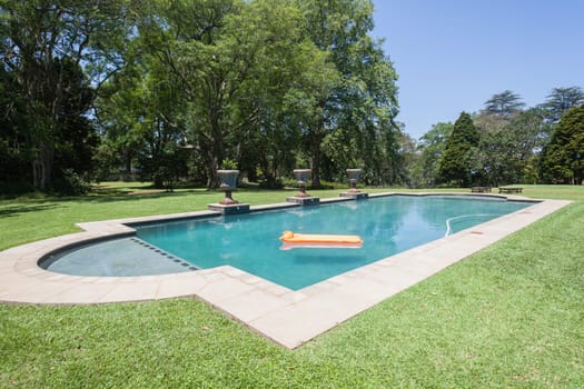 Summer day young girl swimming pool at  private home