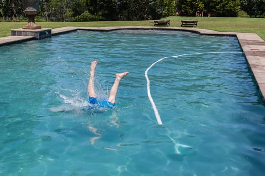 Girls boys running jumping into home  swimming pool summer playtime