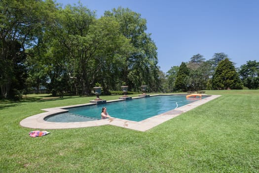 Summer young girls swimming pool at  private home