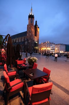 Rynek Glowny Square with St. Mary's Church in the old town of Krakow in southern Poland.