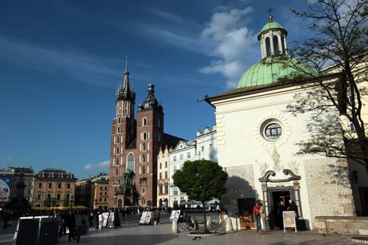 Rynek Glowny Square with St. Mary's Church in the old town of Krakow in southern Poland.