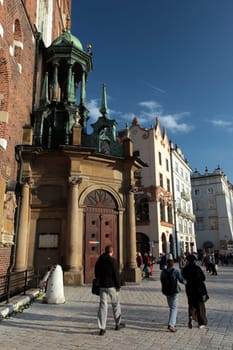 Rynek Glowny Square with St. Mary's Church in the old town of Krakow in southern Poland.