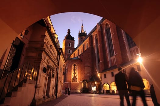 Rynek Glowny Square with St. Mary's Church in the old town of Krakow in southern Poland.