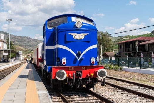 TUA, PORTUGAL - JULY 08, 2017: Historic train on Tua's Train Station. The train runs between June and October along the bank of the river Douro.