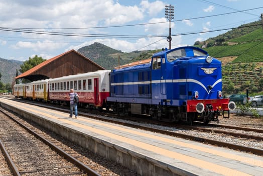 TUA, PORTUGAL - JULY 08, 2017: Historic train on Tua's Train Station. The train runs between June and October along the bank of the river Douro.