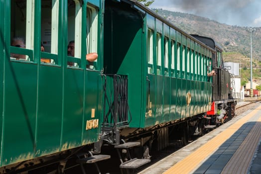 TUA, PORTUGAL - JULY 08, 2017: Historic train on Tua's Train Station. The train runs between June and October along the bank of the river Douro.
