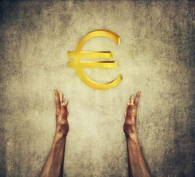 Closeup of two human hands holding a golden euro sign. Financial concept