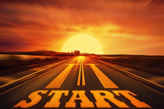 Word Start written on an asphalt road and two arrows as motivation. Long way ahead as a concept of start straight for business.
