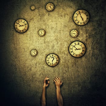 Abstract idea as human hands stretched out and juggling with a lot of clocks set to different times. Wealth and success symbol. Hour perception and time travel concept.
