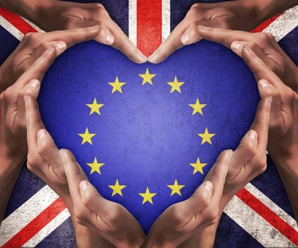 Human hands make heart shape with patterned flag of the European Community inside and the flag of the United Kingdom outside