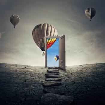 Pathway of opportunity along a dry, cracked desert ground, going to a opened door to another better and colorful world. Road to success symbol. Another reality concept