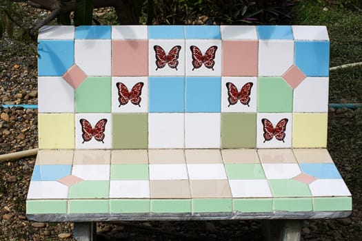 bench titles butterfly decoration detail