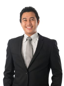 Portrait of good looking young Southeast Asian businessman standing isolated on white background.