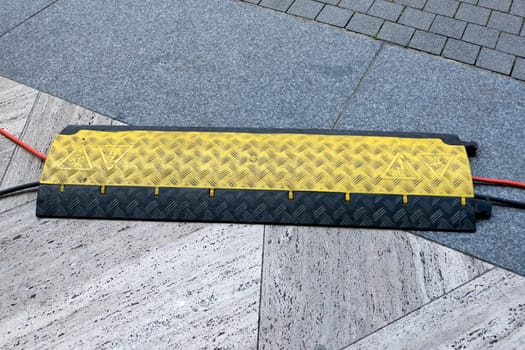 Cable bridge - trip protection with power cable on the ground